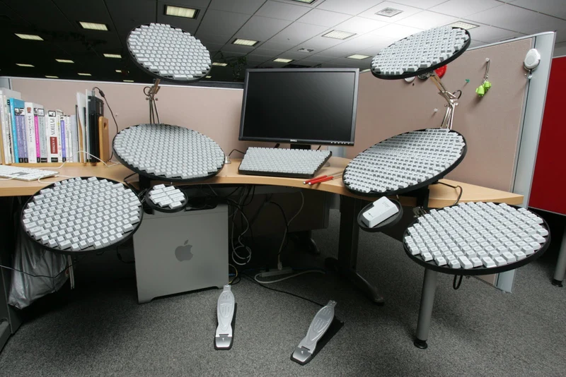 The 2010 Google Japanese Input Drum Set Version, a drum kit made of round keyboards set up around an office desk
